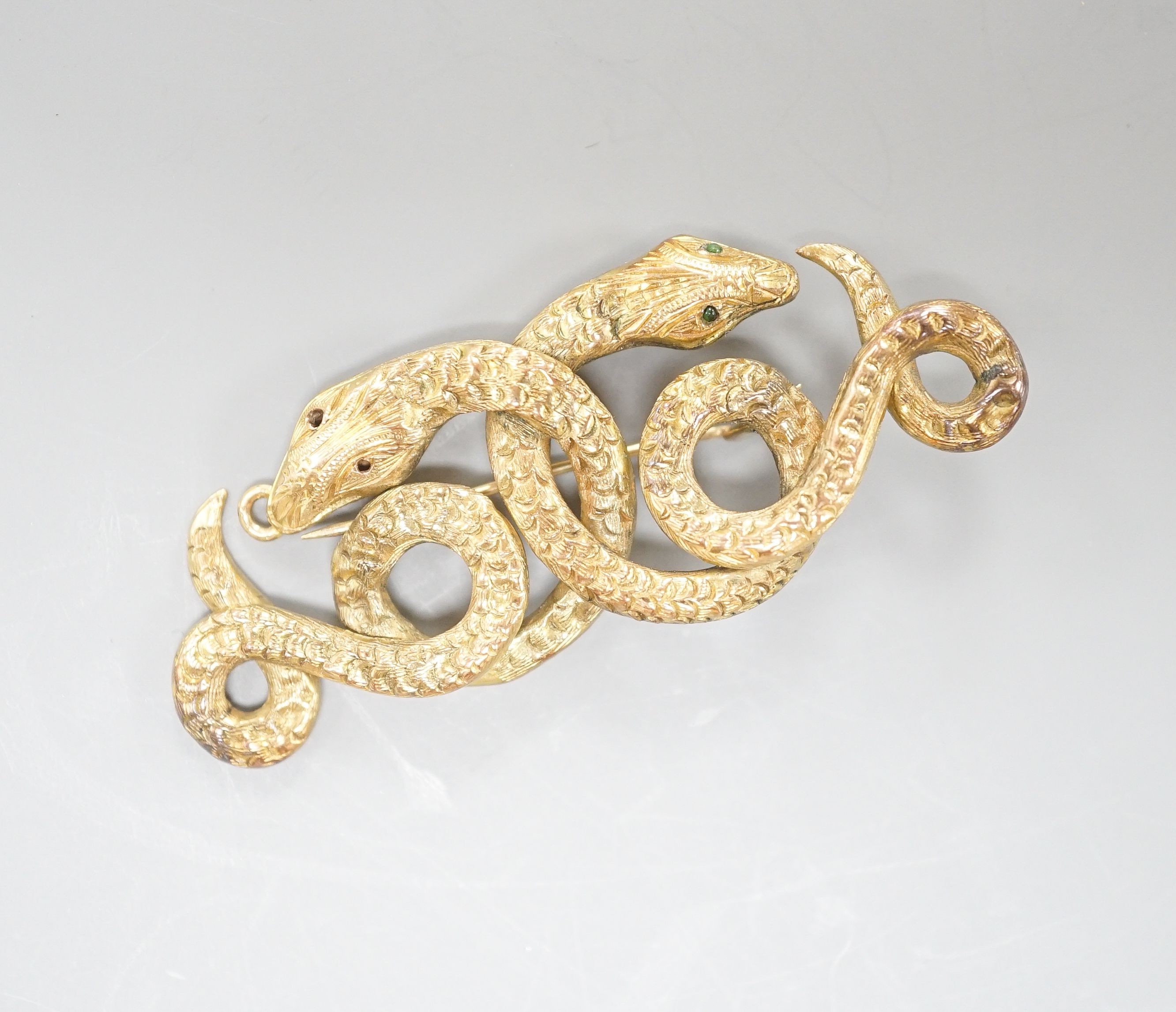 A yellow metal and enamel set twin serpent brooch, (a.f.), 58mm, gross weight 9 grams.